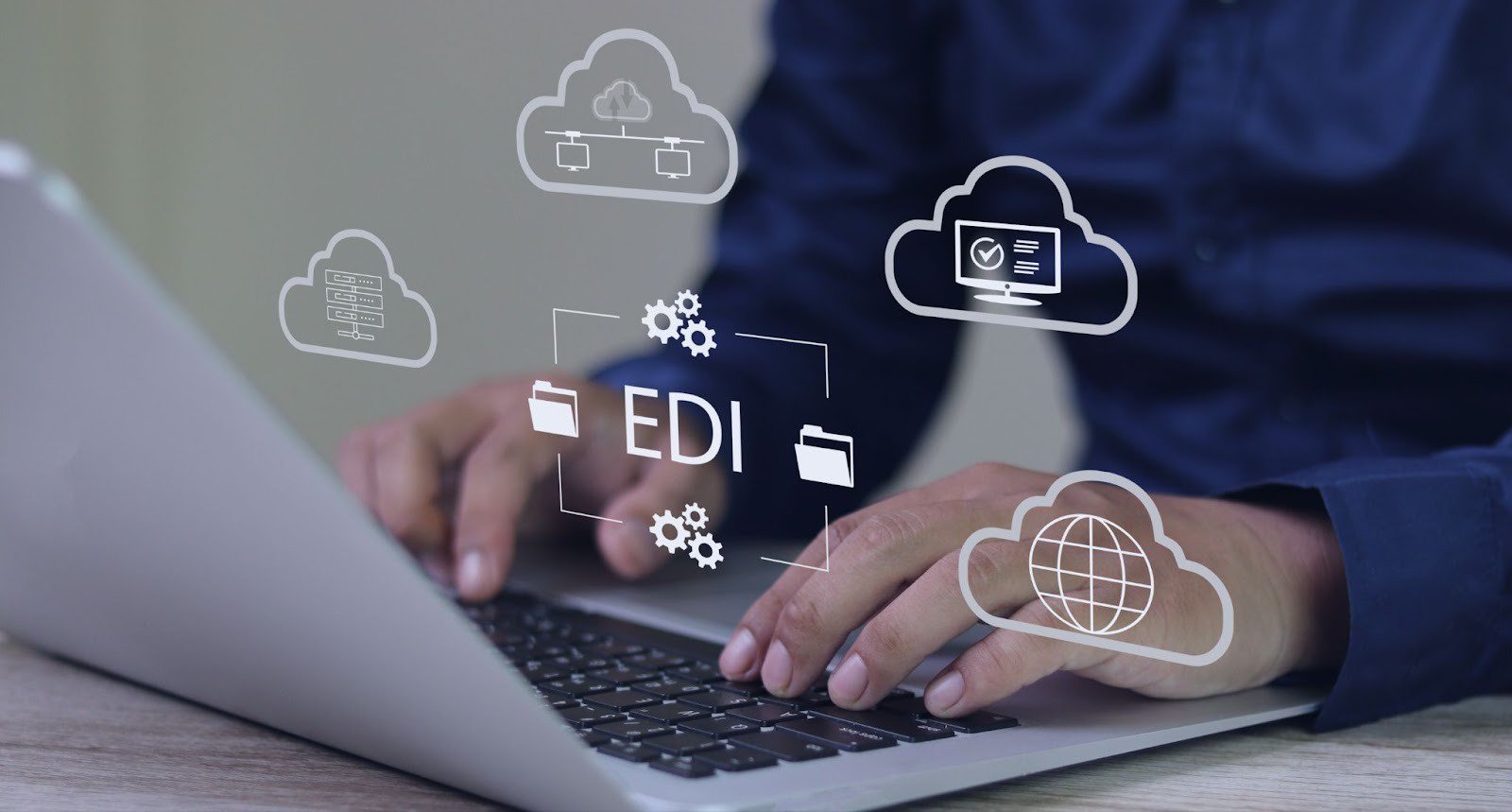EDI, electronic data interchange concept, person using computer on office desk with virtual screen electronic data interchange icon.