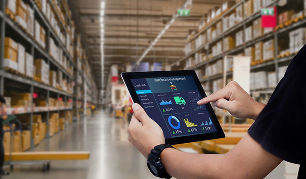 a man using a tablet for material handling automation