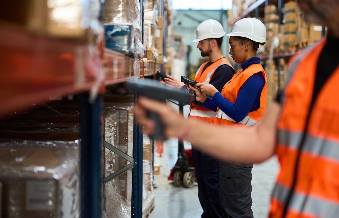 warehouse staff scanning parcel barcodes for cycle count accuracy