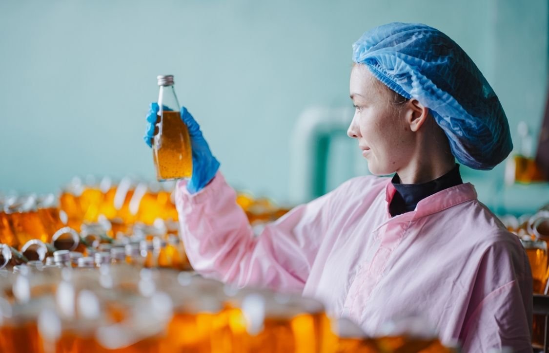 AIB-certified soda warehouse manager checking stocks
